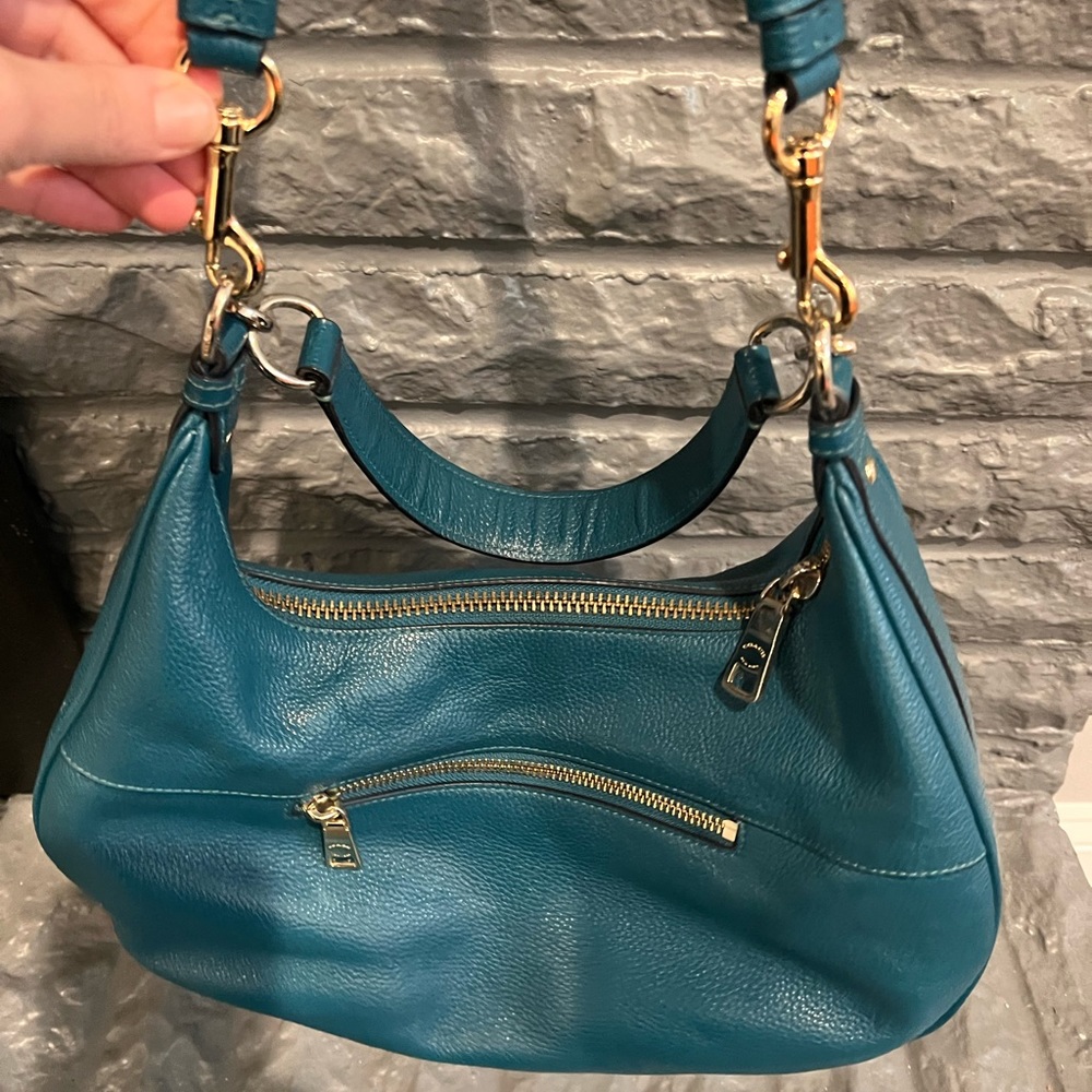 Green Coach hobo bag. One shoulder strap with crossbody option strap.